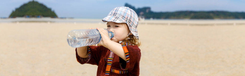 Child drinking water to prevent heat stroke for safety in Abilene